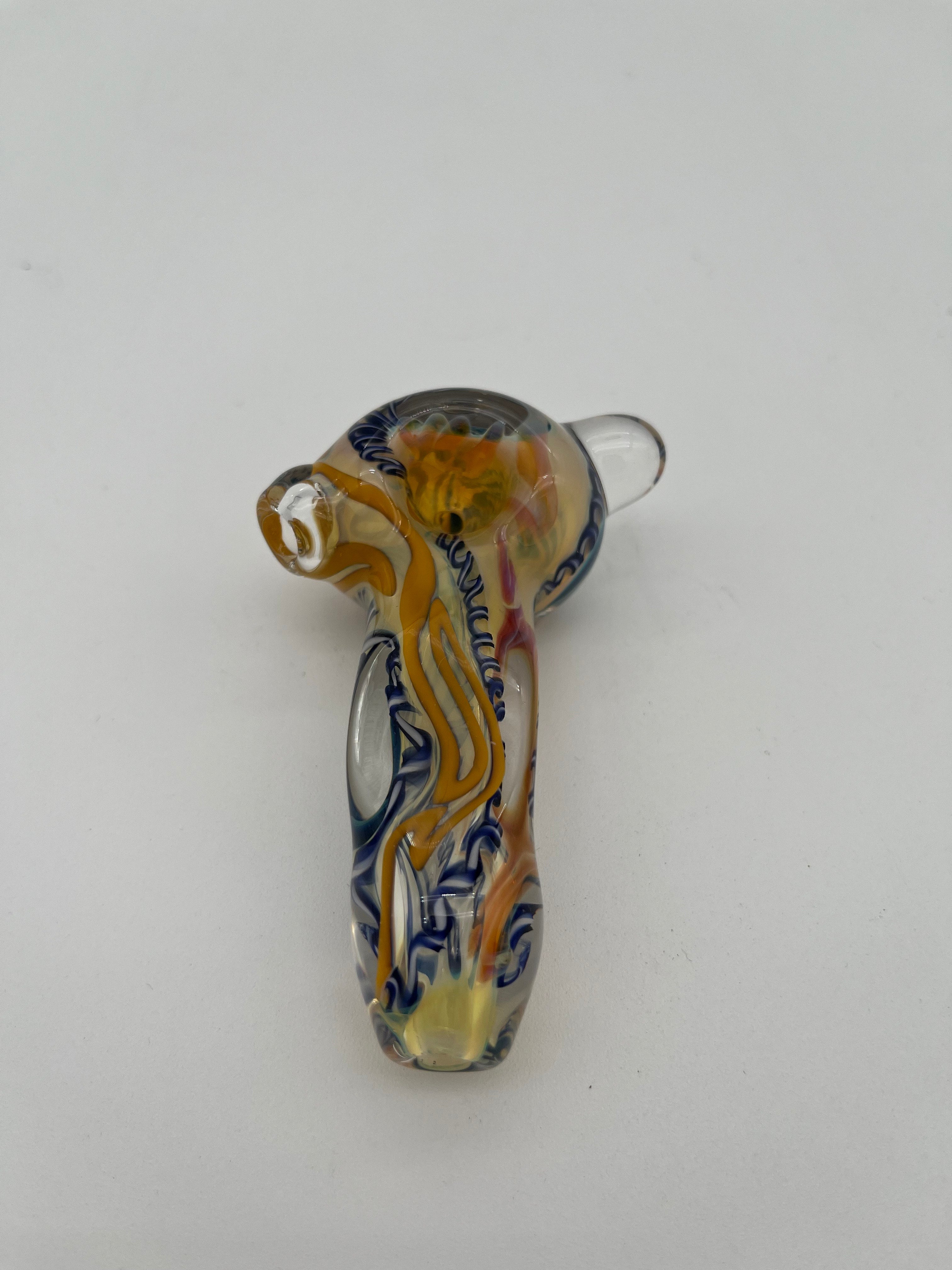 Blue and yellow inside out spiral glass hand pipe made by Nelson Glassworks on a white background. 
