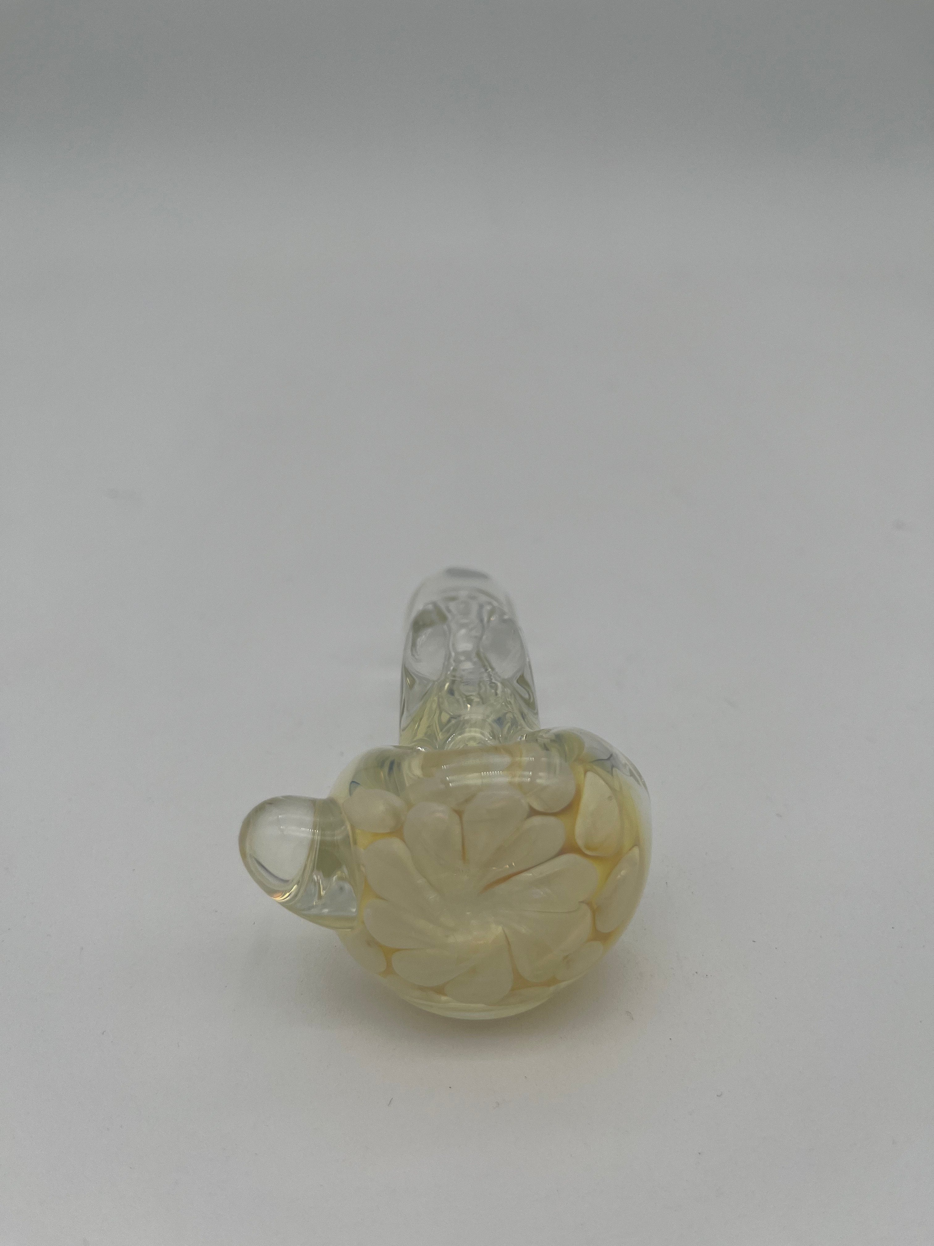 Clear and white floral looking glass pipe made by Nelson Glassworks on a white background.