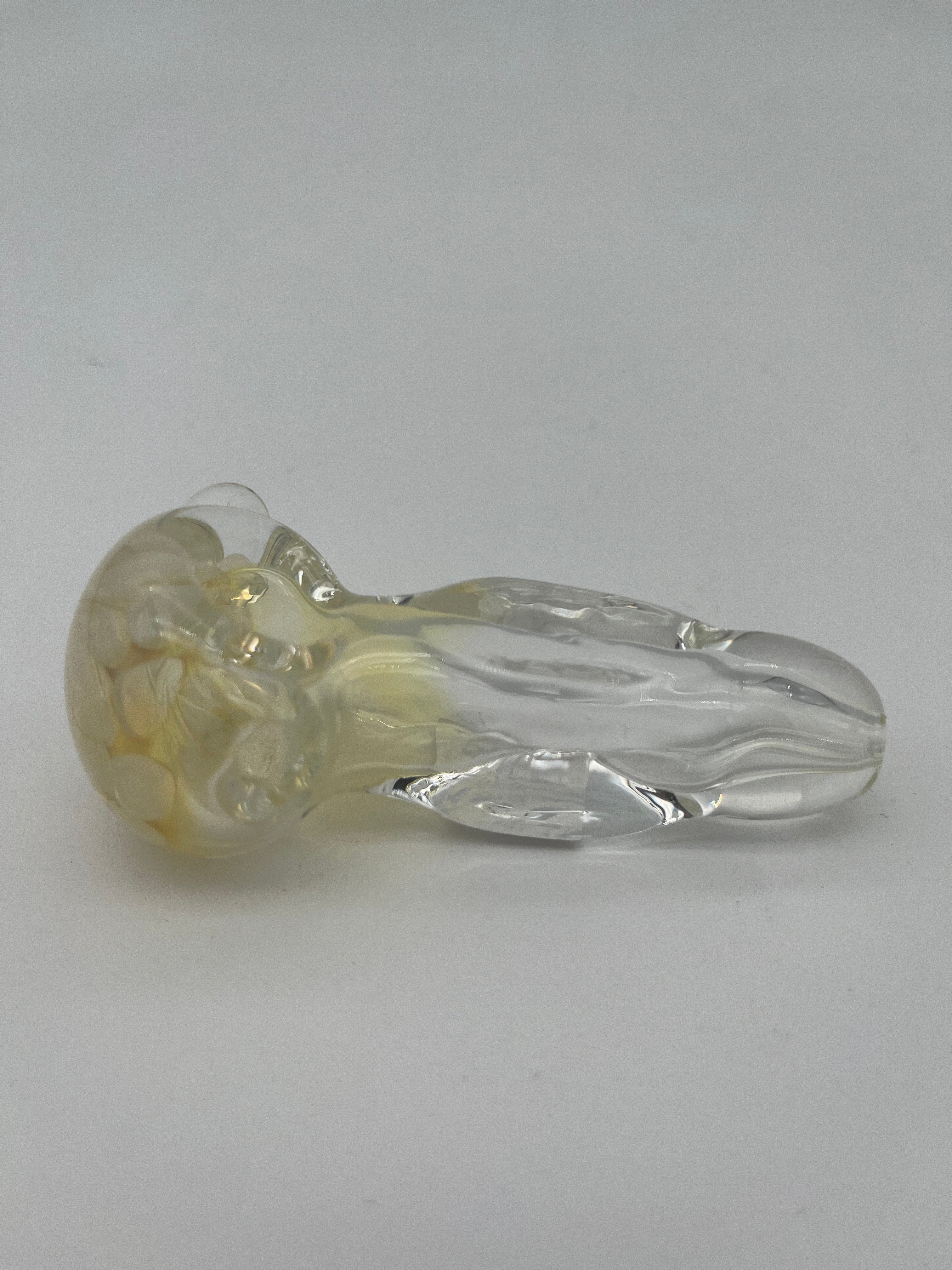 Clear and white floral looking glass pipe made by Nelson Glassworks on a white background.