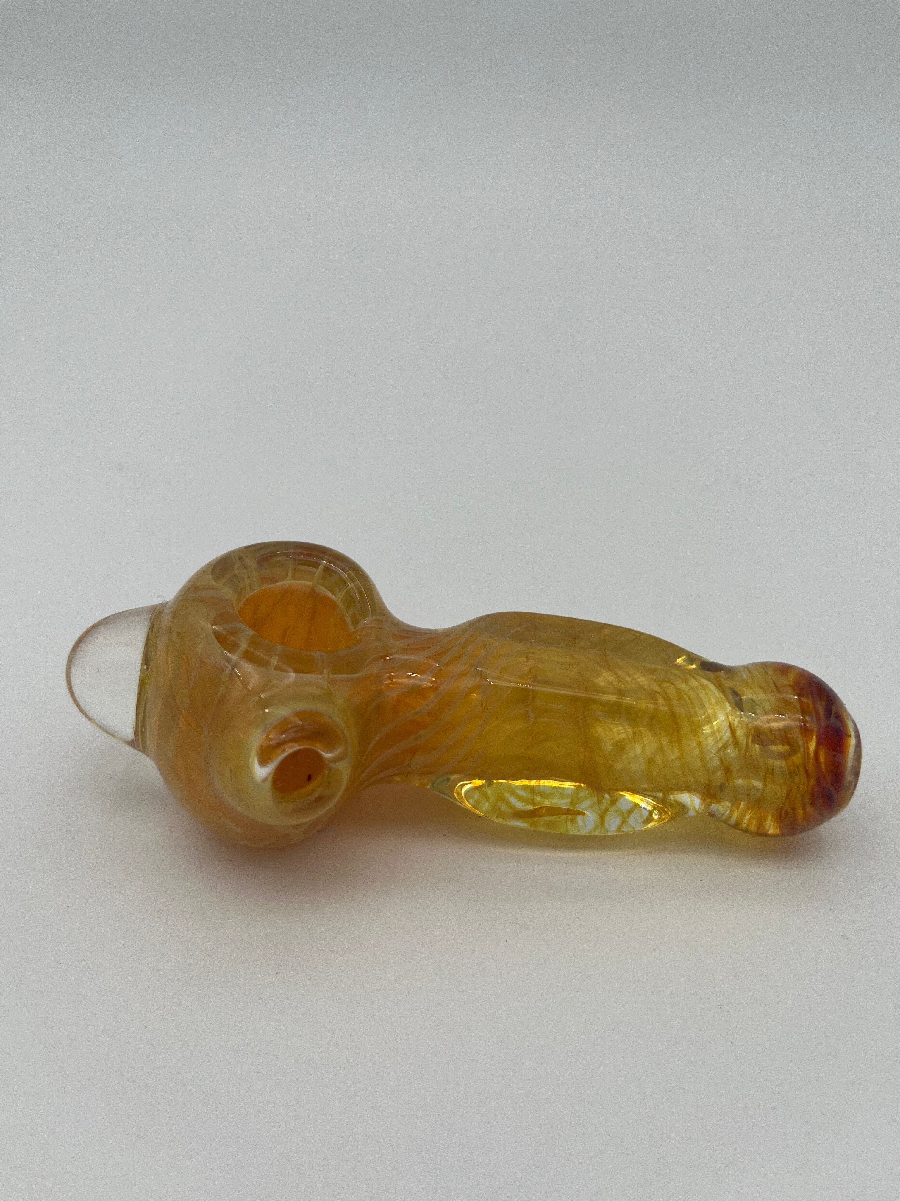 Yellow inside out spiral glass hand pipe made by Nelson Glassworks on a white background