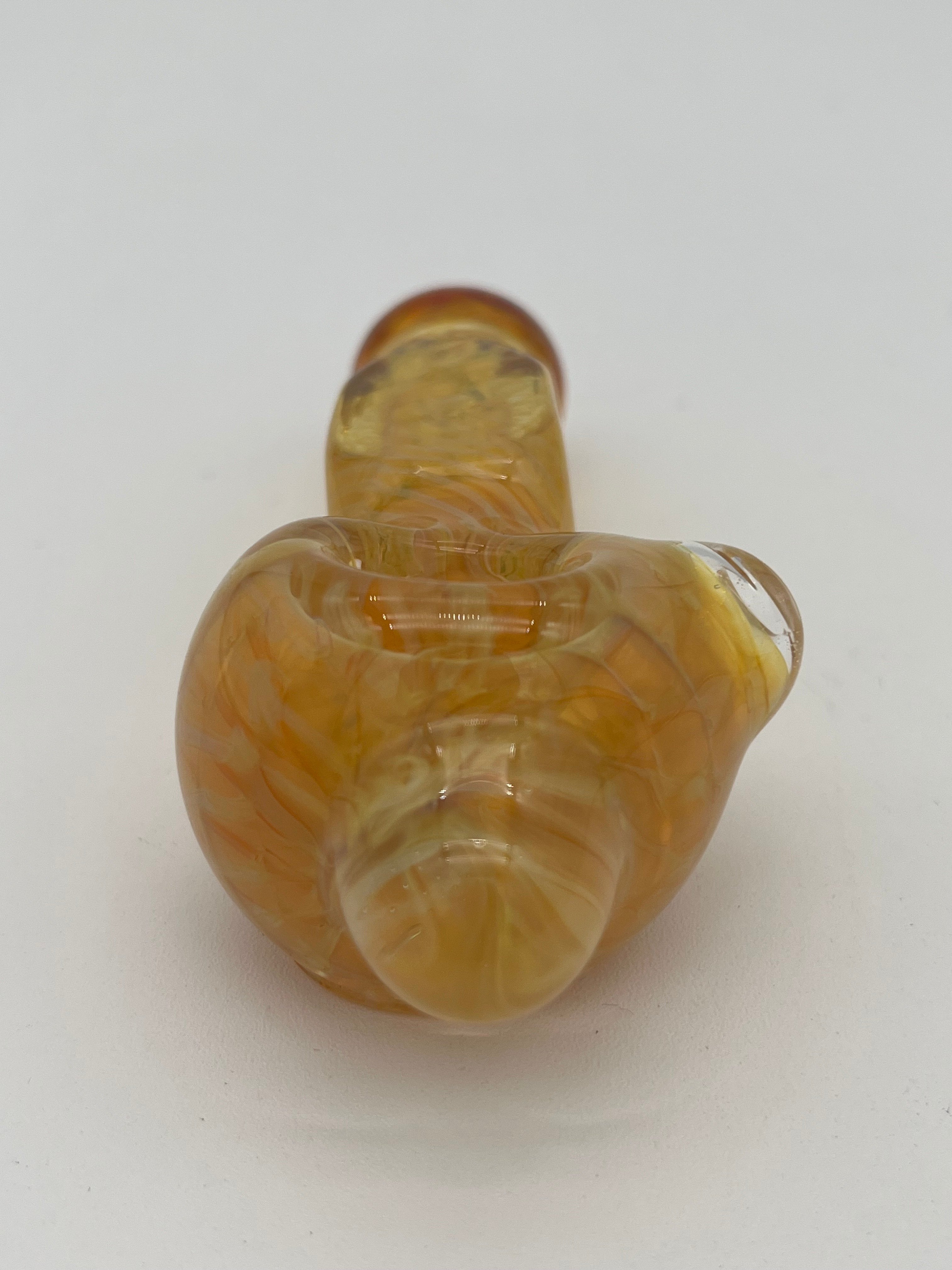 Yellow inside out spiral glass hand pipe made by Nelson Glassworks on a white background