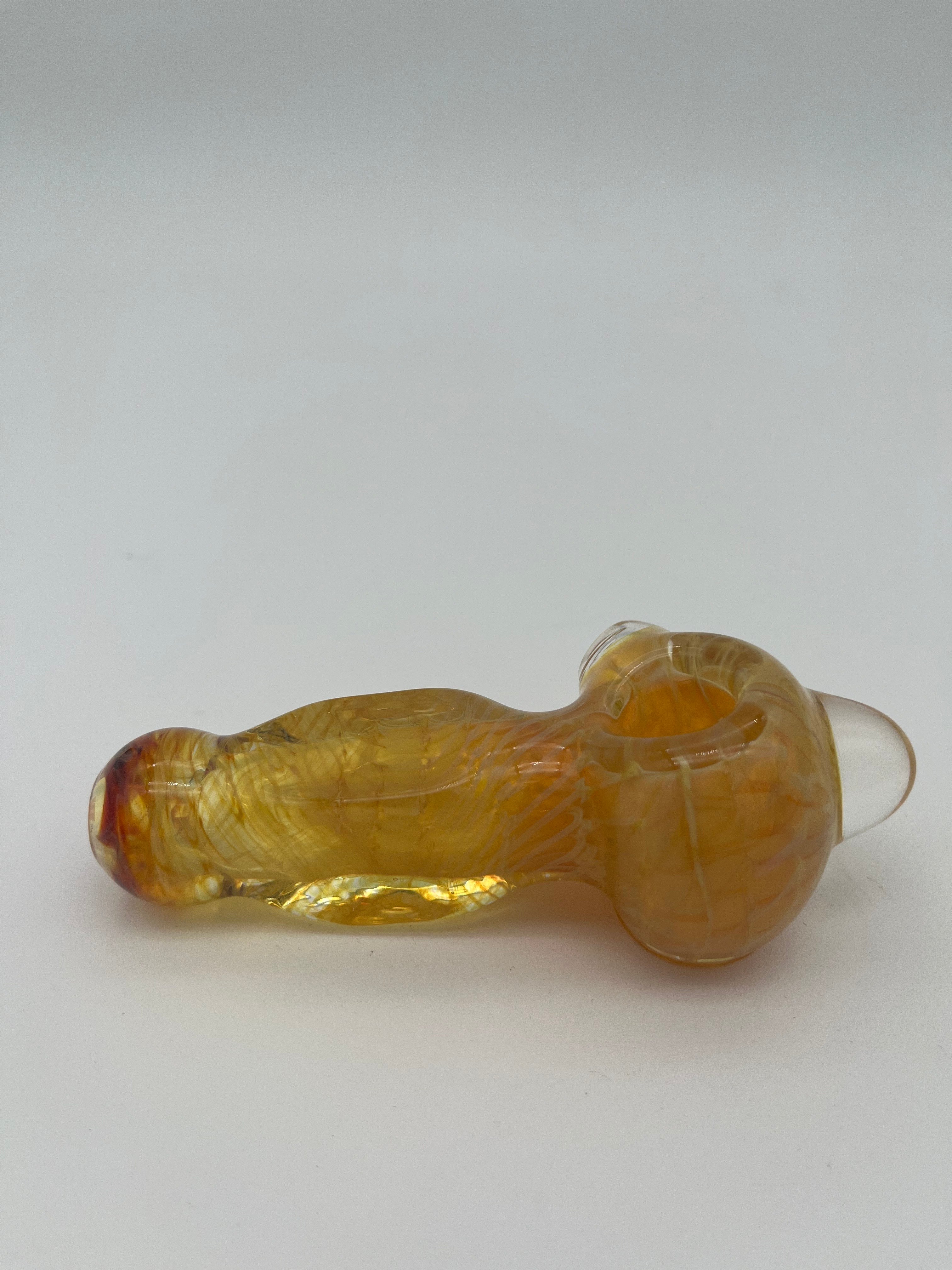 Yellow inside out spiral glass hand pipe made by Nelson Glassworks on a white background