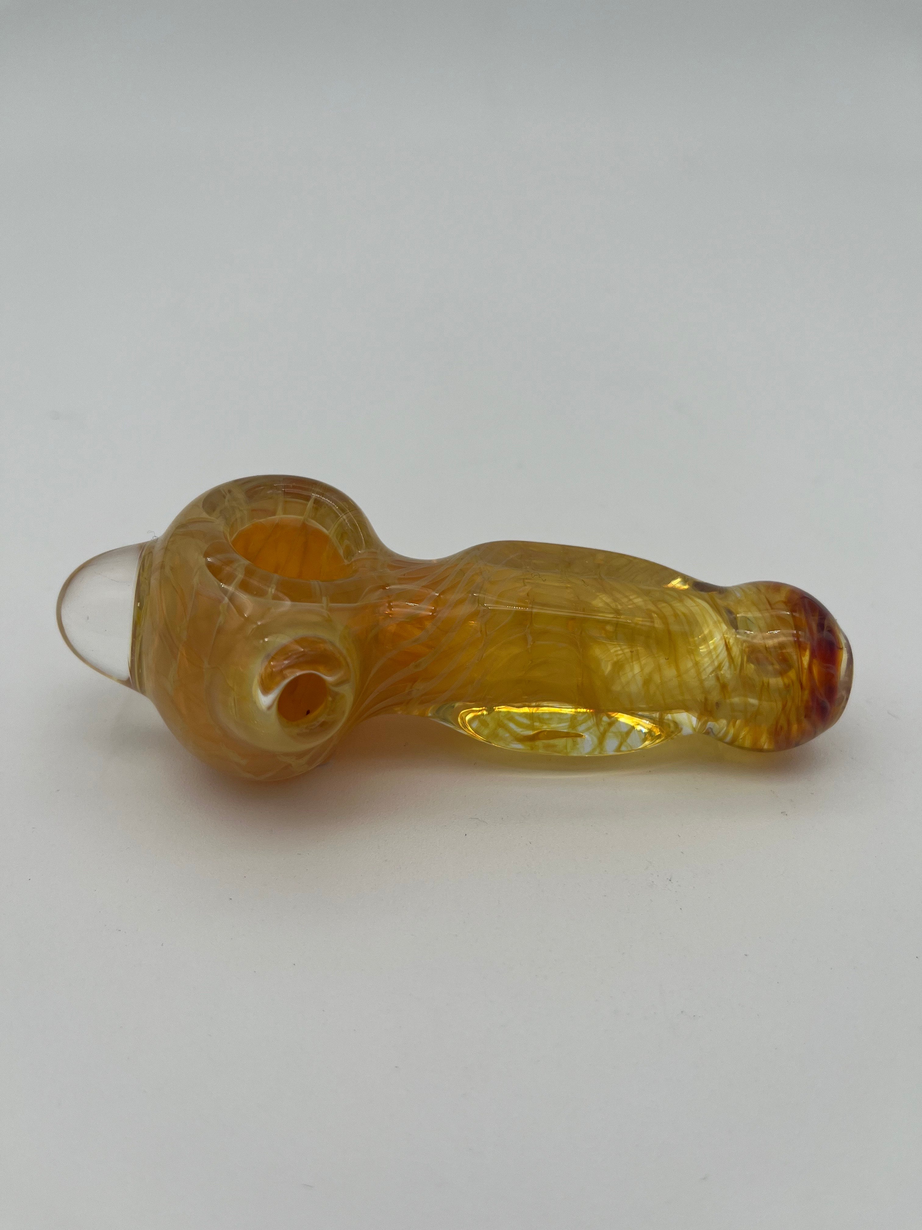 Yellow inside out spiral glass hand pipe made by Nelson Glassworks on a white background